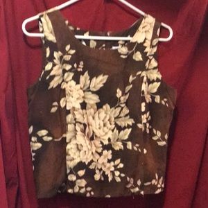 Sleeveless, back button closure, floral print top.